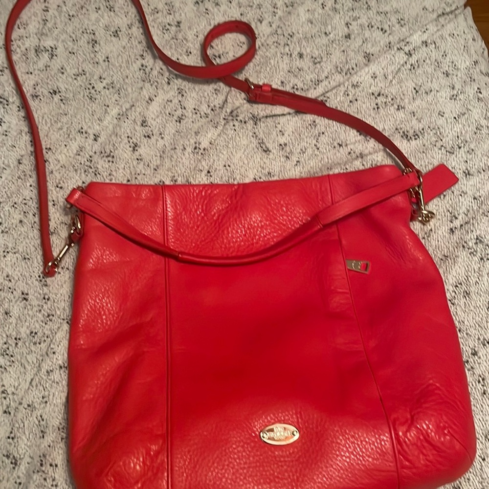 Reddish orangish Coach bag. Great condition
